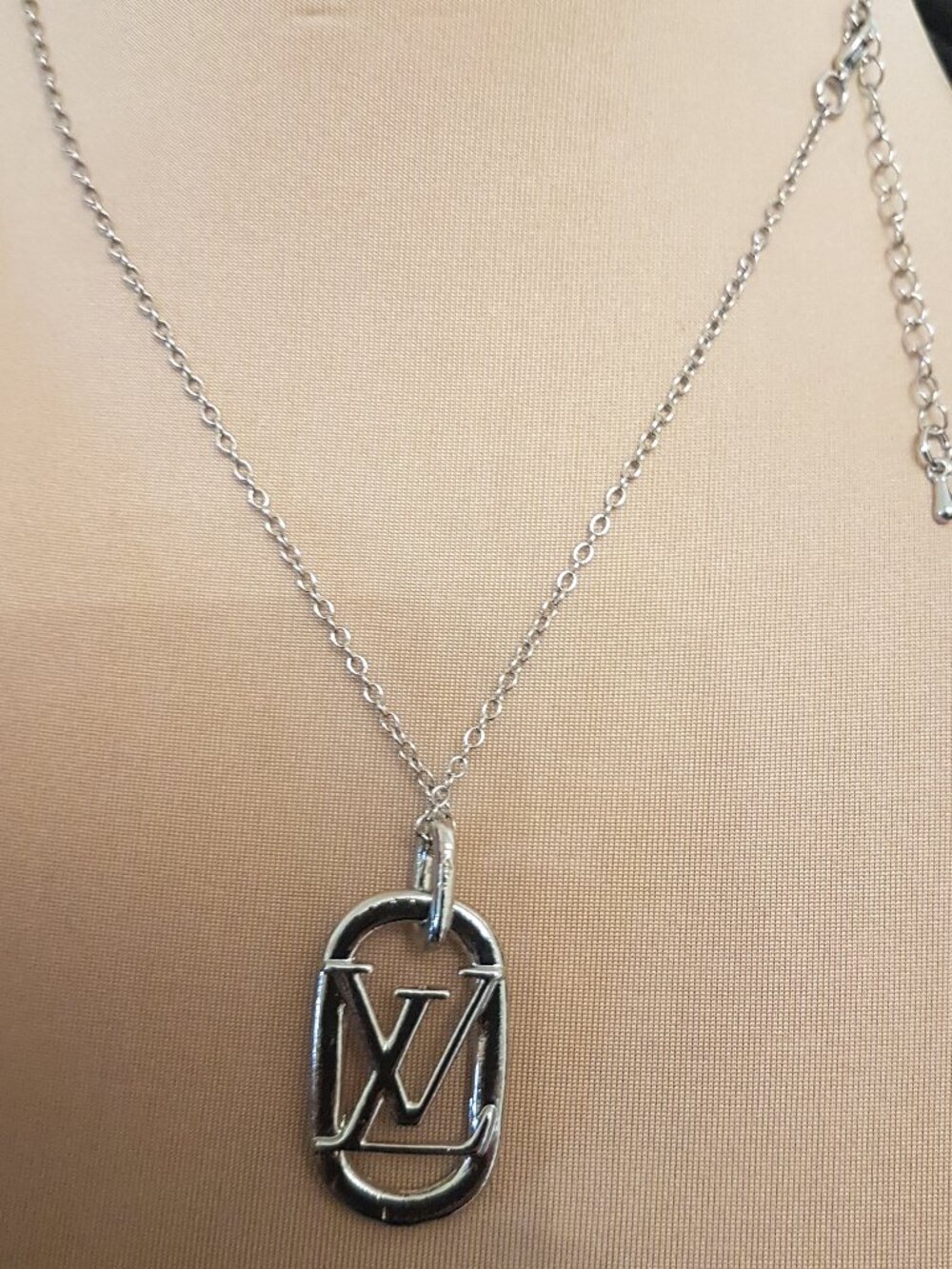 Silver tone charm necklace with  iconic initial